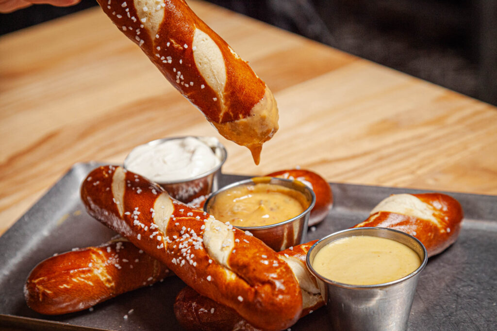 Fresh baked bavarian pretzels - Beer queso, honey mustard and hefeweizen whipped cream cheese