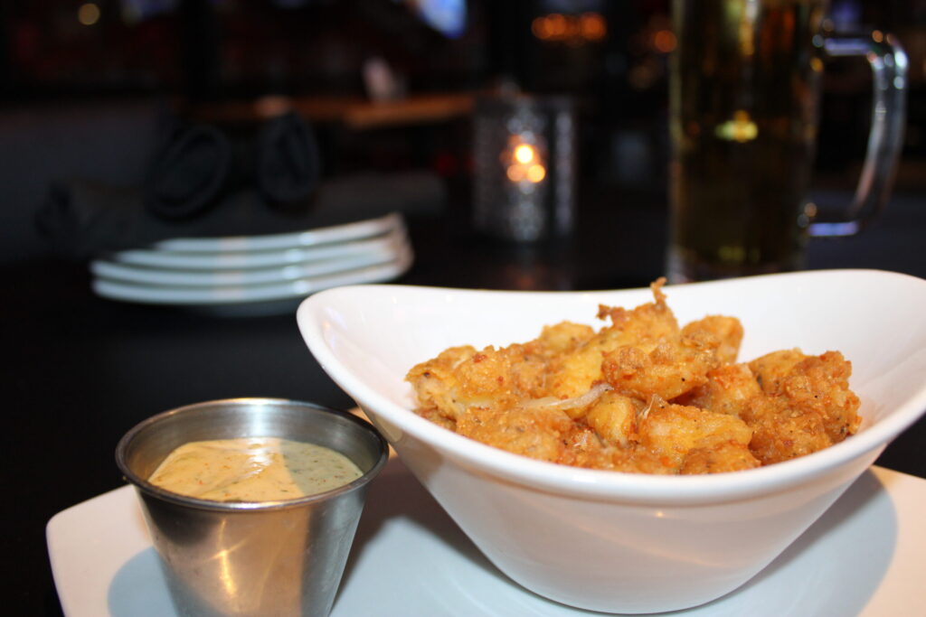 Fried Cheese Curds - 

Served with our signature fatpour sauce. Vegetarian-friendly