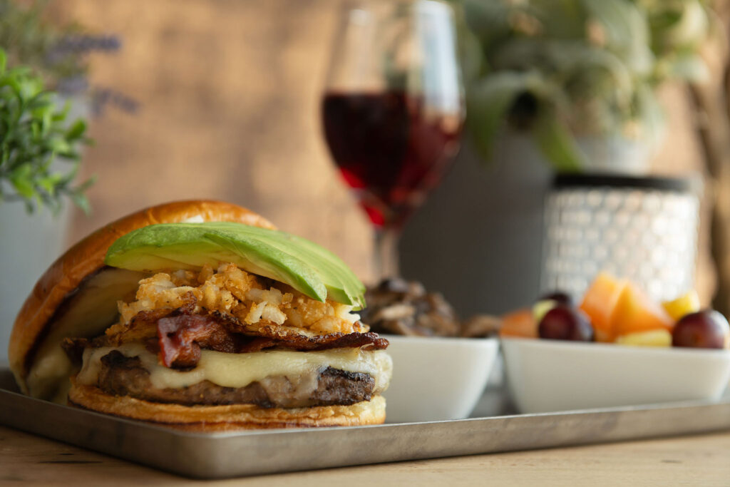 Maple Bacon Cheeseburger with side of fruit and Crispy Brussel Sprouts at Fatpour Wicker Park