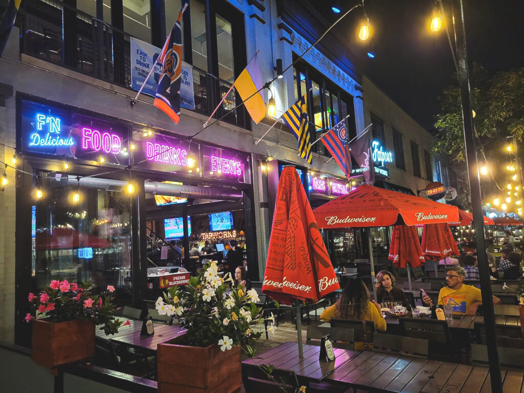 Night time exterior patio with umbrellas at Fatpour Wicker Park