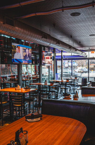 Booths and main dining room with TVs