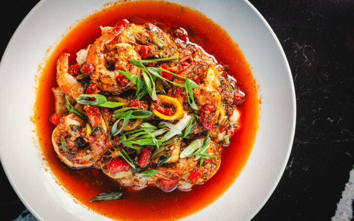SHRIMP & GRITS - SAUTEED SHRIMP, MIXED PEPPERS, WHITE WINE, CREOLE BUTTER, WHITE CHEDDAR HERBED GRITS