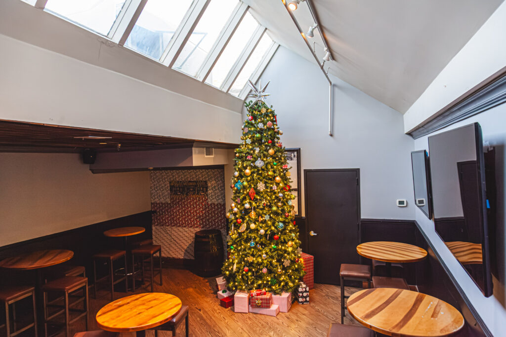 Morrison private party room during the holidays with TVs + decor