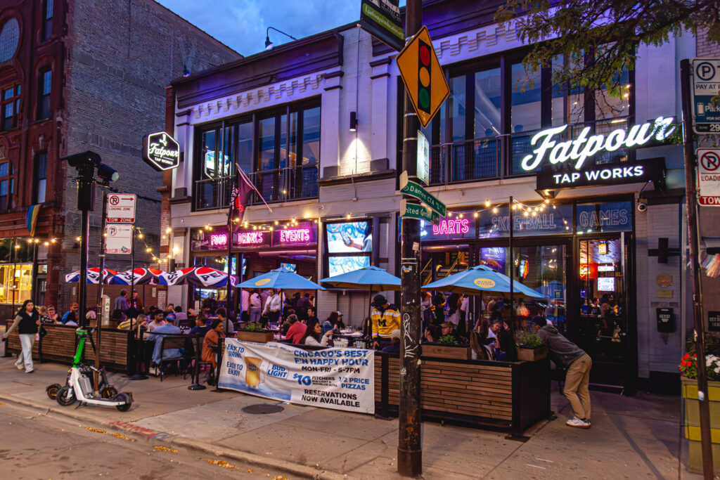 Patio exterior with football game on outdoor TV screens