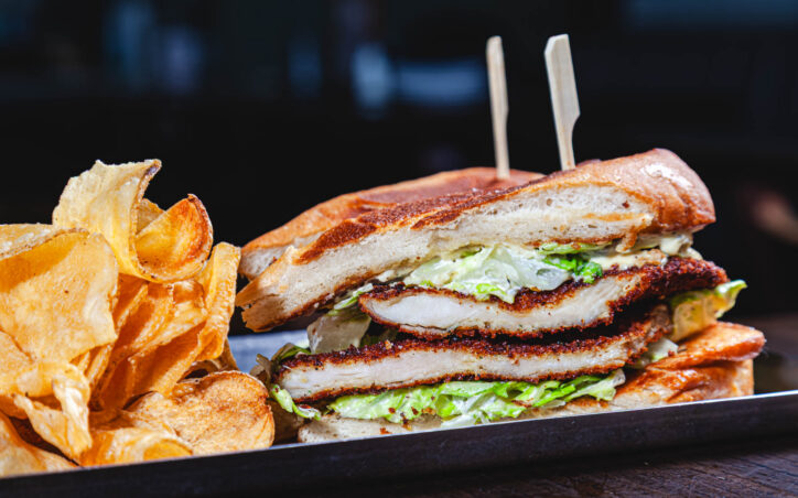 Chicken Caesar Sando - breaded chicken breast, romaine, parmesan cheese, caesar dressing on a toasted baguette