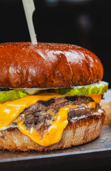 Classic Smash Burger - double smash patty, american cheese, house pickles, dijonnaise, buttery bun